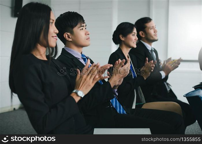 Business people executives applauding in business meeting