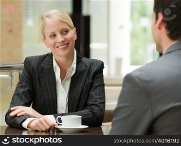 Business people face to face in a restaurant