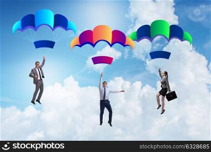 Business people falling down on parachutes. The business people falling down on parachutes