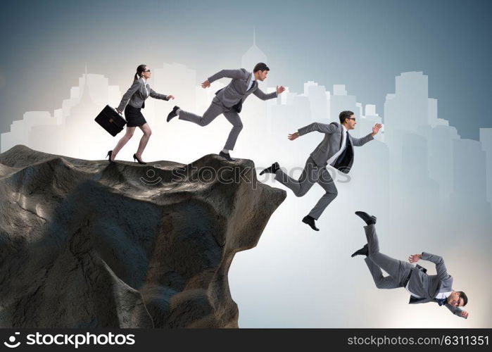 Business people falling off the cliff