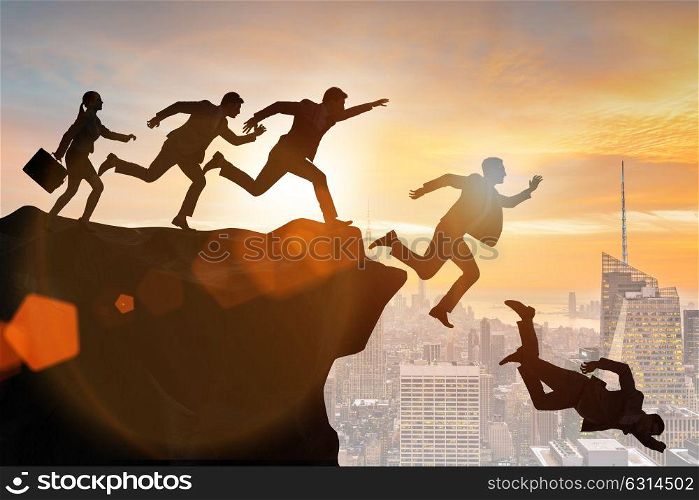 Business people falling off the cliff. The business people falling off the cliff
