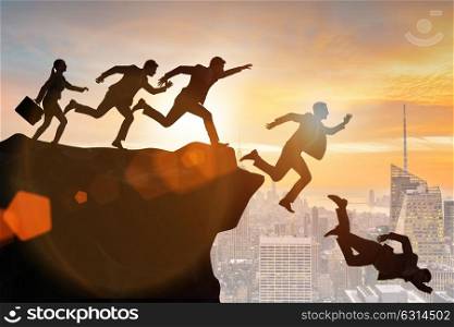 Business people falling off the cliff. The business people falling off the cliff