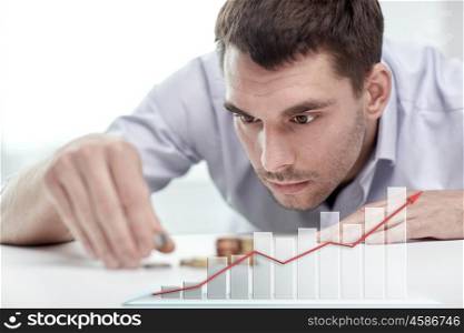 business, people, finances, statistics and money saving concept - businessman putting coins into piles and growing chart