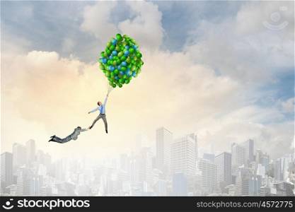 Business people flying in the sky on air balloon. Escape from office