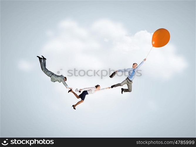 Business people flying in the sky on air balloon. Escape from office