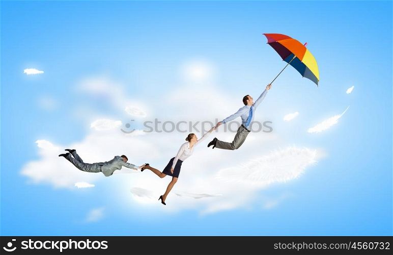 Business people flying in the sky on umbrella. Escape from office