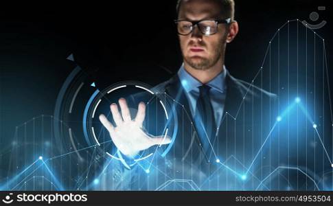 business, people, future technology and cyberspace concept - close up of businessman touching charts projection on virtual screen over dark background. businessman touching virtual charts projection