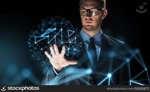 business, people, future technology and cyberspace concept - close up of businessman touching virtual projection over dark background. businessman touching virtual projection