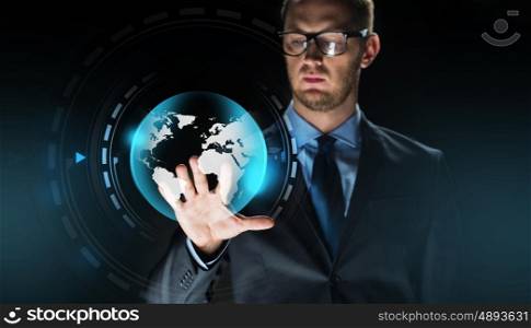 business, people, future technology, mass media and cyberspace concept - close up of businessman touching earth globe projection on virtual screen over dark background