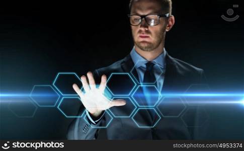 business, people, future technology, network and cyberspace concept - close up of businessman touching virtual screen with hexagonal projection over dark background and laser light. businessman touching virtual hexagonal projection