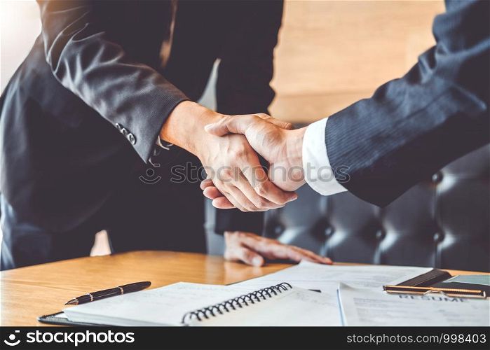 Business people greeting new colleagues while job interviewing shaking hands meeting Planning after during job interview Concept