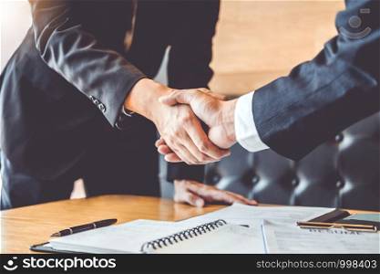 Business people greeting new colleagues while job interviewing shaking hands meeting Planning after during job interview Concept