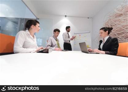 business people group brainstorming on meeting at office, businessman presenting plans, tasks, ideas and projects on white flip board