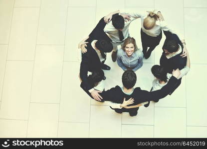 business people group joining hands and stay as team in circle and representing concept of friendship and teamwork