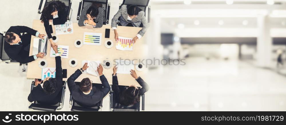 Business people group meeting shot from top view in office . Profession businesswomen, businessmen and office workers working in team conference with project planning document broaden view .. Business people group meeting shot from top view broaden view