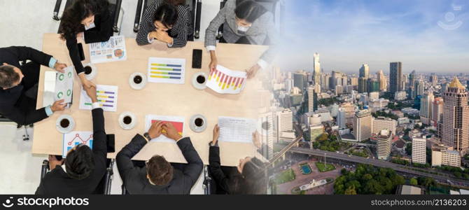 Business people group meeting shot from top view in office . Profession businesswomen, businessmen and office workers working in team conference with project planning document broaden view .. Business people group meeting shot from top view broaden view