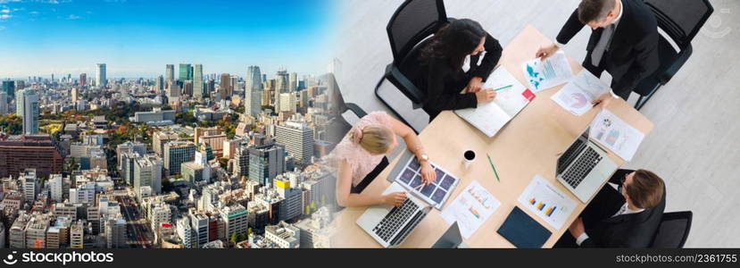 Business people group meeting shot from top widen view in office . Profession businesswomen, businessmen and office workers working in team conference with project planning document on meeting table .. Business people group meeting shot from top widen view