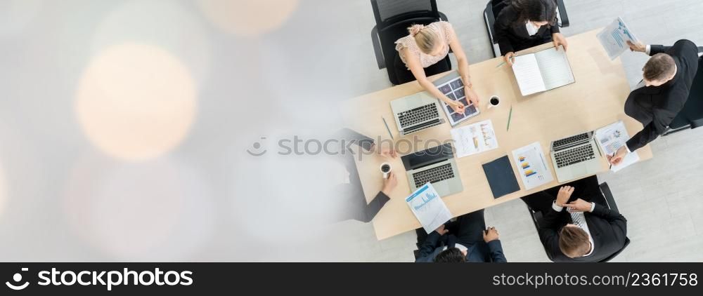 Business people group meeting shot from top widen view in office . Profession businesswomen, businessmen and office workers working in team conference with project planning document on meeting table .. Business people group meeting shot from top widen view