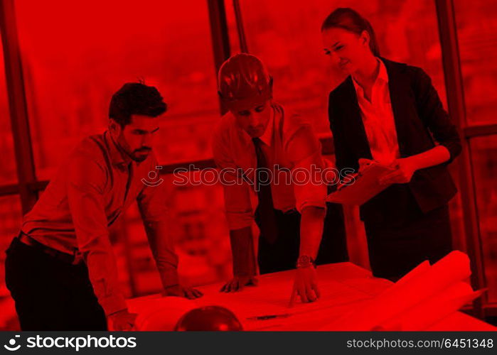 business people group on meeting and presentation in bright modern office with construction engineer architect and worker looking building model and blueprint planbleprint plans