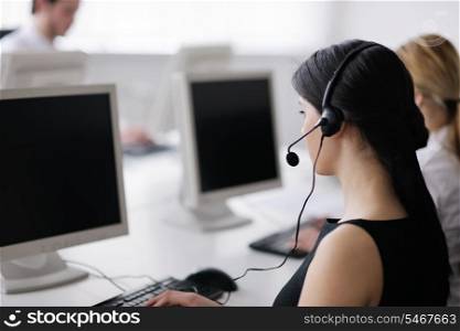 business people group with headphones giving support in help desk office to customers, manager giving training and education instructions