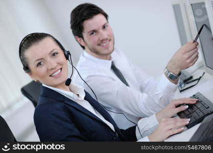 business people group with headphones giving support in help desk office to customers, manager giving training and education instructions