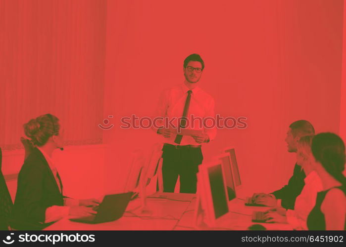 business people group with headphones giving support in help desk office to customers, manager giving training and education instructions duo tone