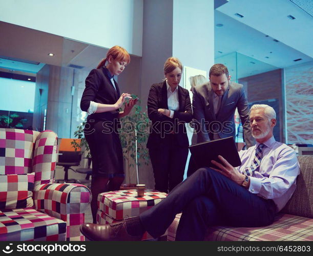 business people group with young adults and senior on meeting at modern bright office interior.