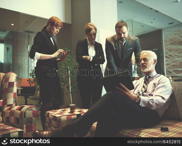 business people group with young adults and senior on meeting at modern bright office interior.