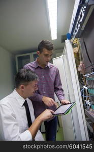 business people group working on tablet computer, network engineers in server room