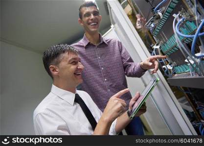 business people group working on tablet computer, network engineers in server room