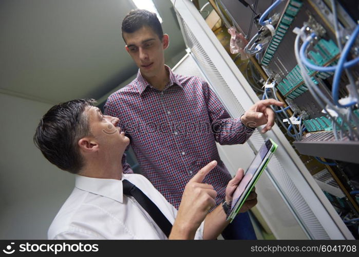 business people group working on tablet computer, network engineers in server room