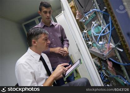 business people group working on tablet computer, network engineers in server room