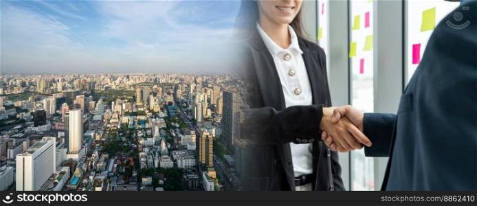 Business people handshake in corporate office in widen view showing professional agreement on a financial deal contract.. Business people handshake in corporate office in widen view