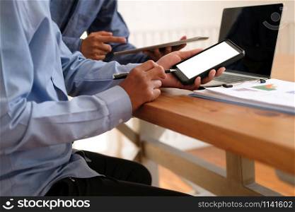 business people have a meeting. businessman using tablet smart phone working on performance revenue with co-worker team.