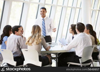 Business People Having Board Meeting In Modern Office