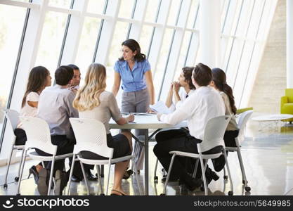 Business People Having Board Meeting In Modern Office