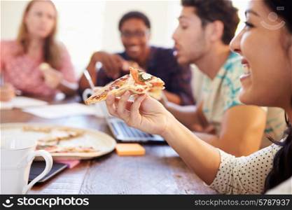 Business People Having Meeting And Eating Pizza