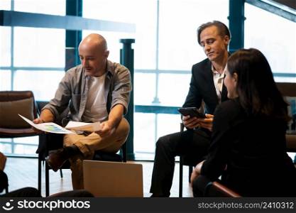 Business People having meeting in office,Successful business team of four sitting in office and planning work.