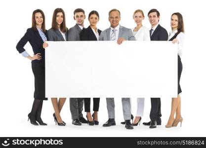 Business people holding a banner. Group of business people holding white blank banner isolated on white background