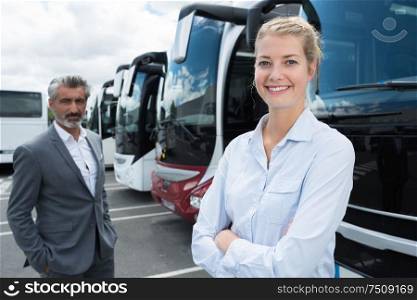 business people in a bus garage