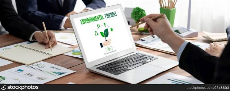 Business people in green corporate company planning eco-friendly and environmental conservative to reduce CO2 and implement net zero policy in meeting room with eco idea on laptop screen. Trailblazing. Business people in green company planning eco-friendly strategy. Trailblazing