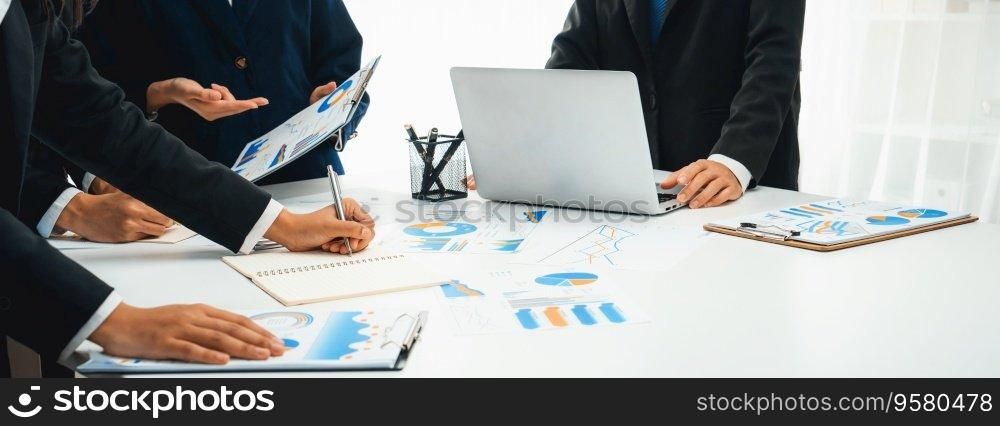 Business people in group meeting in formal attire share idea discussing report for company profit in creative workspace for start up business shot in close up view on group meeting table . Oratory .. Business people group meeting share idea discuss report for profit oratory