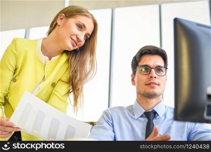 Business people in meeting discussing about financial results in office room / Business team working project together on the desk , Partner colleagues are talking in the document report chart graph