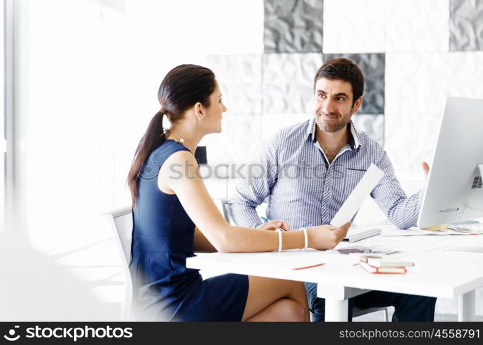 Business people in modern office. Business people working and discussing in modern office