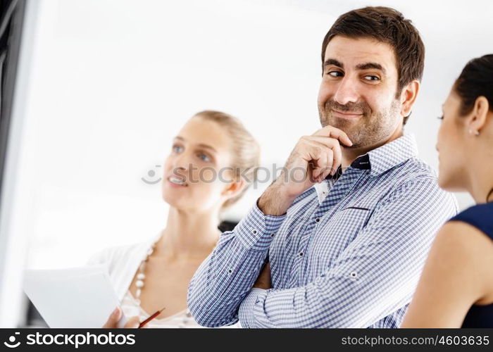 Business people in modern office. Business people working and discussing in modern office