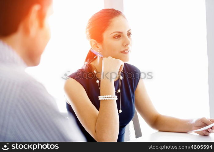 Business people in modern office. Business people working and discussing in modern office