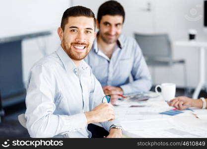 Business people in modern office. Business people working and discussing in modern office