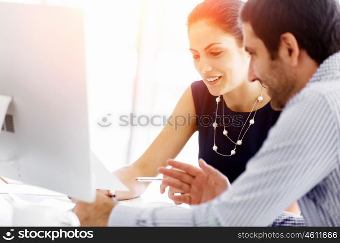 Business people in modern office. Business people working and discussing in modern office