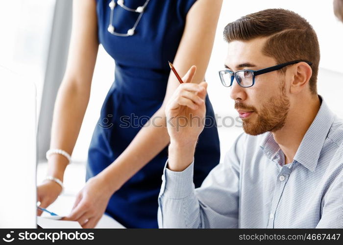 Business people in modern office. Business people working and discussing in modern office