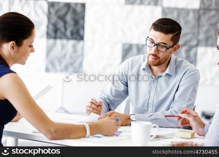 Business people in modern office. Business people working and discussing in modern office